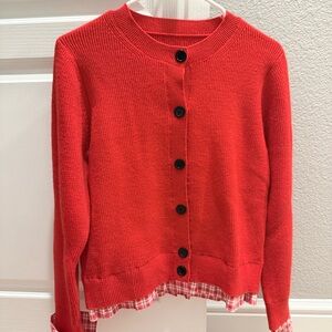 Red cardigan with check pattern